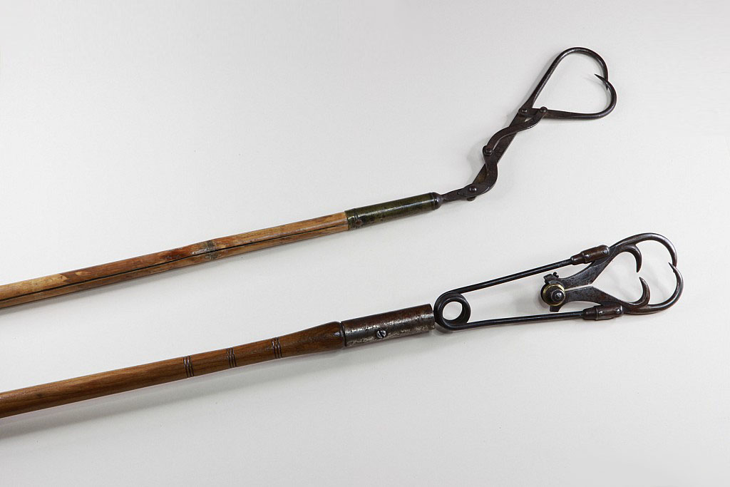 A vintage/ antique bamboo handled fishing gaff/ hook.